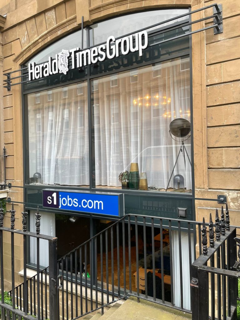 shop front signage - Herald Times Group