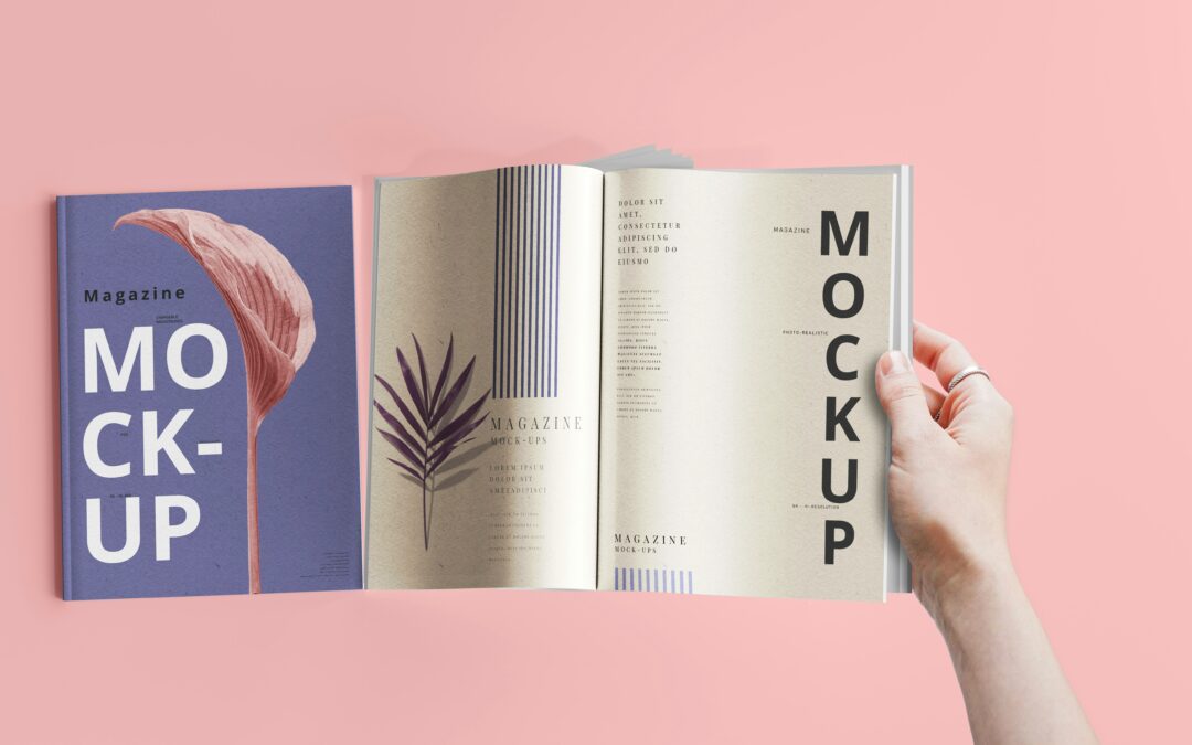 a hand holding a book open to a mockup